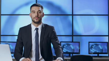 Male News Presenter in Broadcasting Studio.