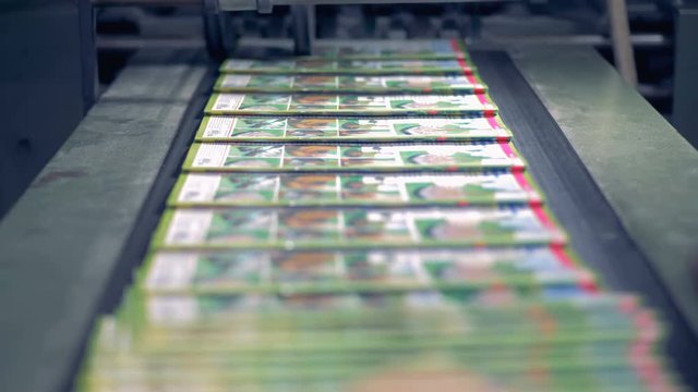 Stacks of magazines at a print office, close up.