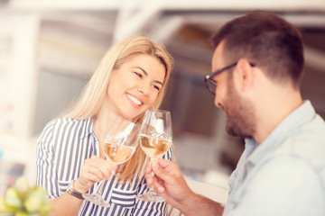 young couple is toasting their success