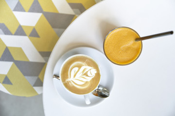Coffee Cappucino and Orange Juice on white table