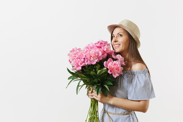 Young tender woman in blue dress, hat holding bouquet of beautiful pink peonies flowers isolated on white background. St. Valentine's Day, International Women's Day holiday concept. Advertising area.