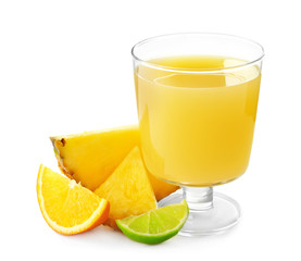 Glass of sweet pineapple juice with fruits slices on white background