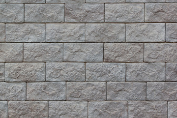 Brick wall with big gray bricks. Used as a background.