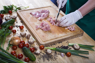 Raw ground beef meat with ingredients for cooking