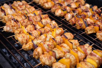 Grilled vegetable and meat skewers on a grill pan. Shish kebab from chicken, pepper and bacon