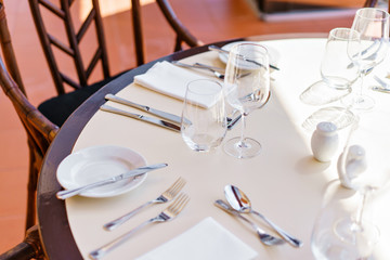 Classic Dinnerware in the restaurant. Table appointments for dinner on terrace