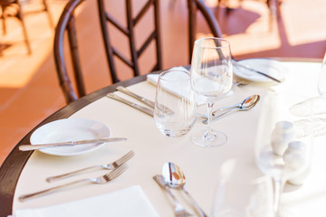 Classic Dinnerware in the restaurant. Table appointments for dinner on terrace
