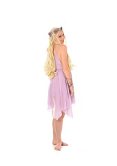 full length portrait of blonde fairy girl, standing pose with back to the camera. isolated on white background.