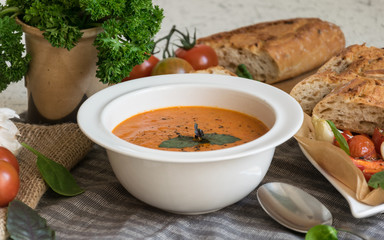 Roasted pepper soup and roasted tomatoes with fresh basil and home-made onion baguette