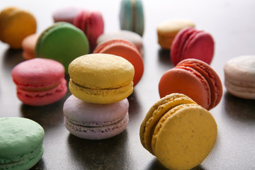 Colorful macarons on dark background