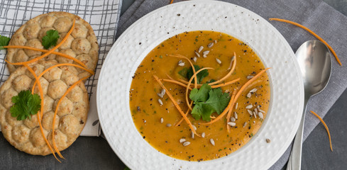Carrot soup with curry and fresh coriander