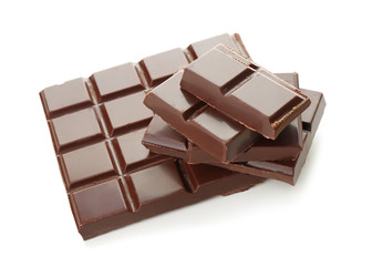 Pieces of dark chocolate on white background