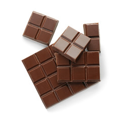 Pieces of dark chocolate on white background