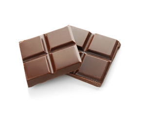 Pieces of dark chocolate on white background