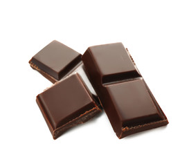 Pieces of dark chocolate on white background