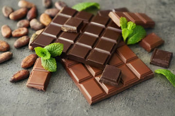 Dark and milk chocolate on grey background