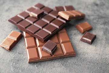 Dark and milk chocolate on grey background
