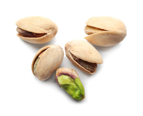 Tasty pistachio nuts on white background