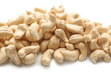 Tasty cashew nuts on white background