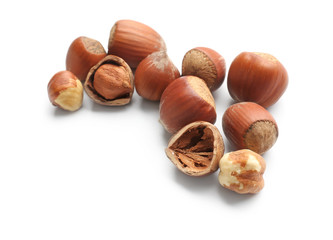 Tasty hazelnuts on white background