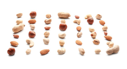 Different types of nuts on white background