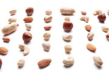 Different types of nuts on white background