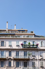 Fototapeta na wymiar Pretty window facade with flowers in Nice, france