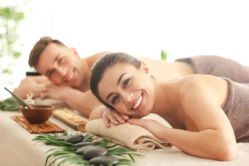 Poster Young couple relaxing in spa salon © Pixel-Shot