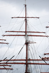 A large mast of a huge sailing ship.A large mast of a huge sailing ship.