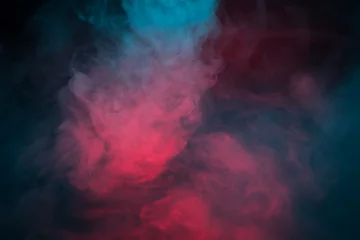 Zelfklevend Fotobehang Kleurrijke rook op een zwarte close-up als achtergrond © vfhnb12