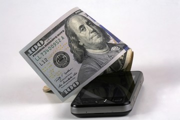 Cellphone with a dollar, model on dollar banknote.