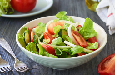 Vegetable salad with cucumbers and tomatoes in a bowl     