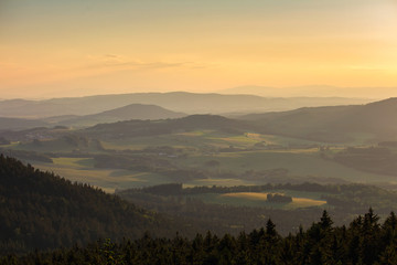 Nice sunset on forest and trees from kravi mountains, Czech landscape