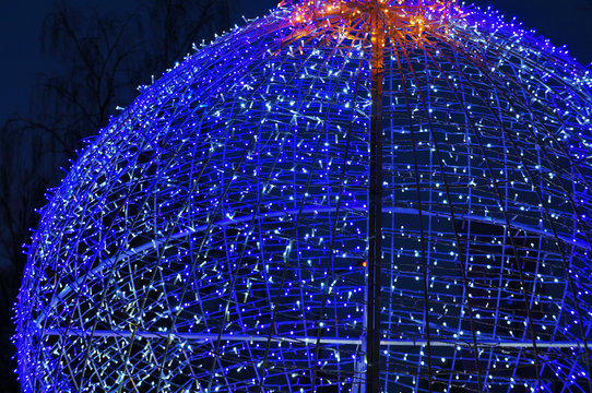 Glowing blue garland in the shape of a ball