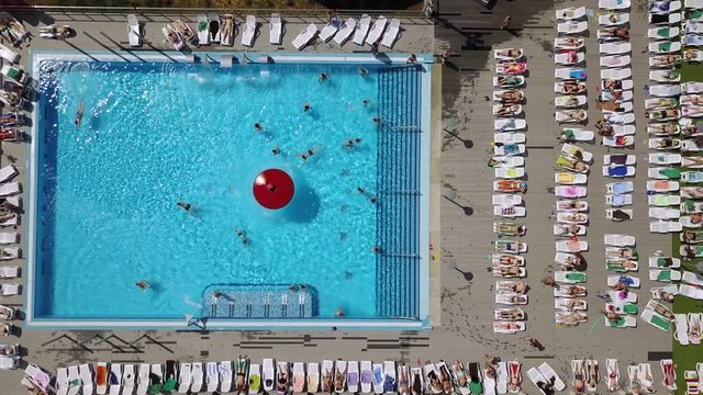 Summer Day Famous Crowded Outdoor Swimming Pool Aerial Down View Panorama 4k 
