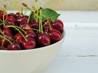 Organic cherries from home garden in a bowl.
