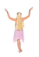 Fototapeta premium full length portrait of blonde fairy girl, standing pose with back to the camera. isolated on white background.