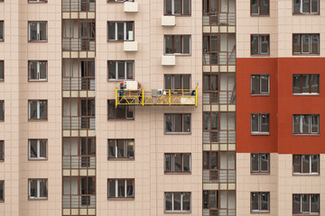 Fototapeta na wymiar Installation of boxes for air conditioners on the facade of the building