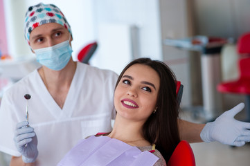 Portrait of a dentist and a beautiful girl in dentistry.