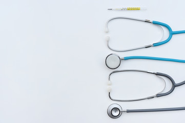 close up of stethoscope and thermometer for background