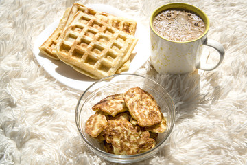 Pancakes, waffles and coffee for breakfast.