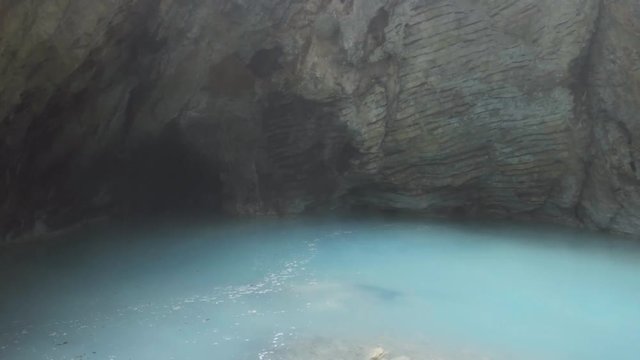 Natural underground karst mineral lake Proval with pure blue water in Pyatigorsk.