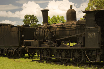 Fototapeta na wymiar Old, abandoned steam train engine and coal car. Dorrigo, New South Wales, Australia.