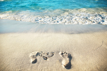 beautiful footprints in the sand near the sea on nature background