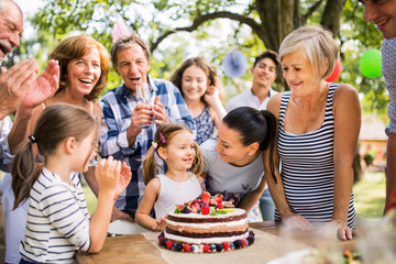 Family celebration or a garden party outside in the backyard.