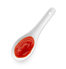 Spoon with red sauce on white background