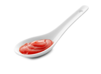Tomato sauce in spoon on white background