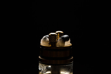 Vape close-up with smoke on a black background
