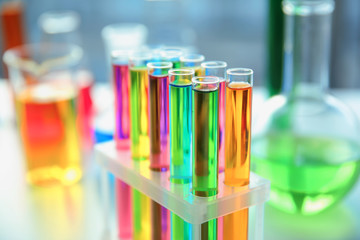 Test tubes with colorful samples in laboratory, closeup - obrazy, fototapety, plakaty