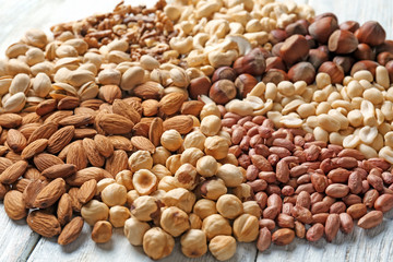 Pile of different nuts on table, closeup